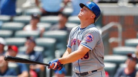 The Mets' Jay Bruce reacts after popping up
