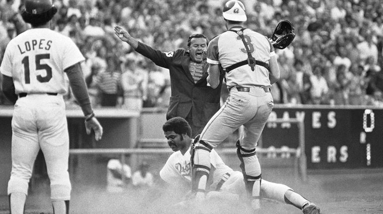 Home plate umpire Dutch Rennert calls Los Angeles