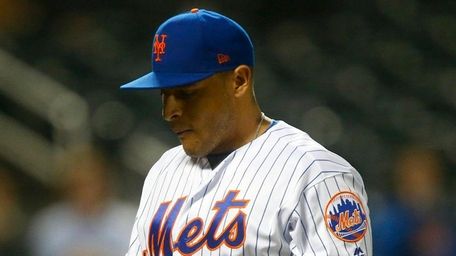 Mets pitcher AJ Ramos walks to the dugout