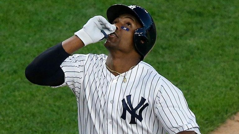 Yankees third baseman Miguel Andujar crosses home plate
