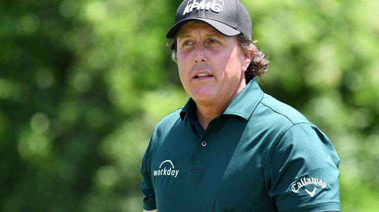 Phil Mickelson prepares to take a tee shot