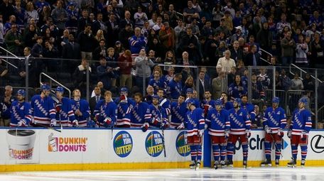 The New York Rangers bench looks on prior