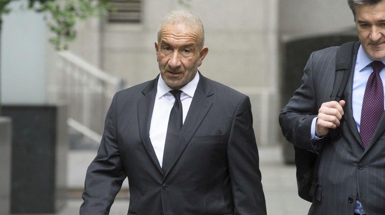 Former SUNY official Alain Kaloyeros, left, arrives at