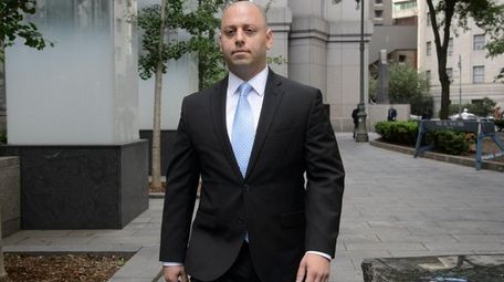 Adam Skelos arrives at a federal courthouse in