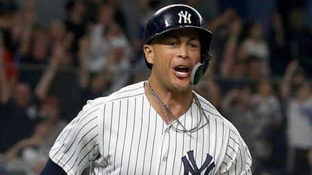Giancarlo Stanton celebrates his walk-off, two-run home run