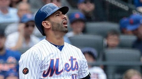 Mets outfielder Jose Bautista reacts after striking out
