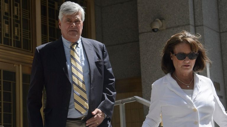 Dean Skelos, left, and his wife, Gail, leave