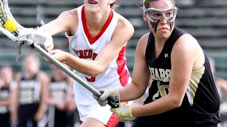 St. Anthony's Kerrin Maurer gets ball hit away