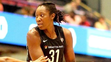 The Liberty's Tina Charles controls the play against