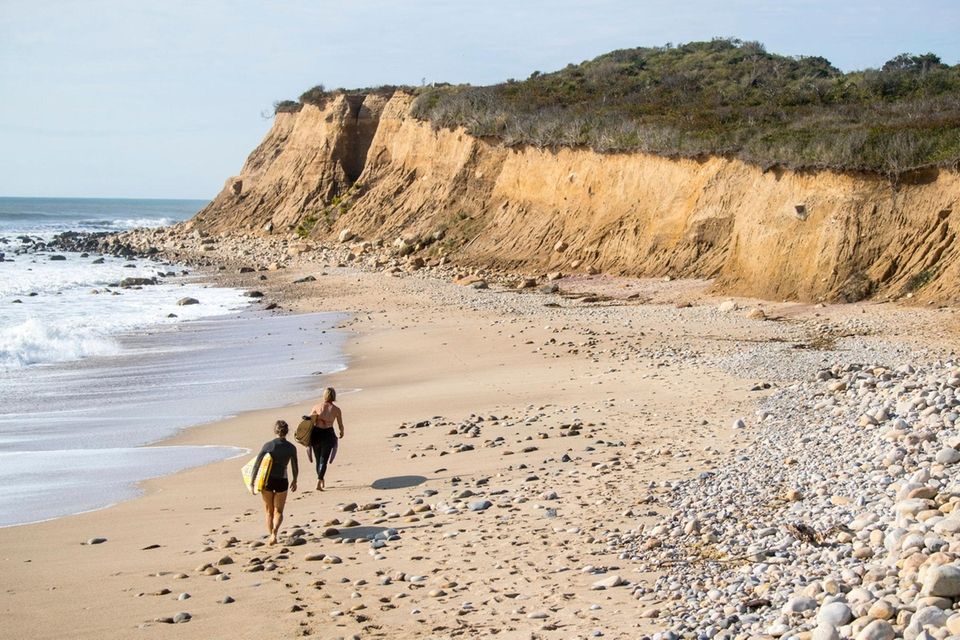 Surfers hunt Long Island waves near Camp Hero