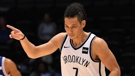 Nets guard Jeremy Lin reacts after he sinks