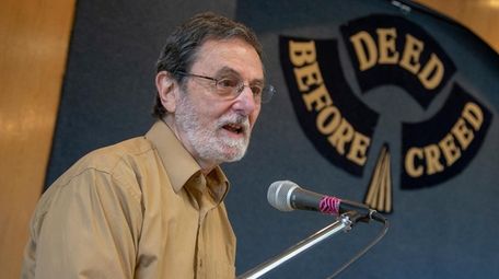 Arthur Dobrin speaks to those gathered in June