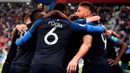 France's players celebrate the opening goal during the