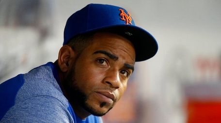 Yoenis Cespedes of the Mets looks on from