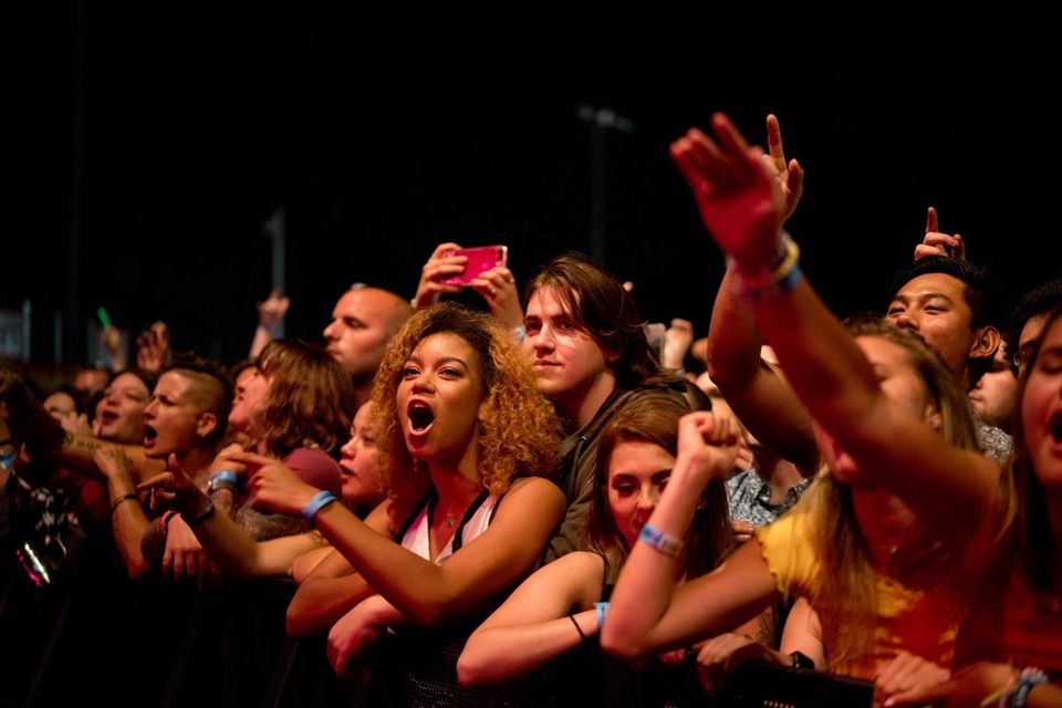 Fans cheer as Sublime with Rome performs during