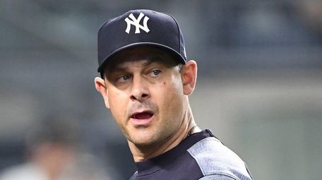 Yankees manager Aaron Boone looks up on his