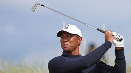 Tiger Woods tees off on the sixth hole