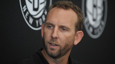 Nets general manager Sean Marks speaks with the