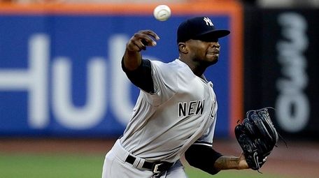 Yankees pitcher Domingo German throws against the Mets