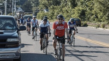 Huntington Bicycle Club members ride on Mill Dam