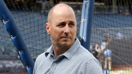 Yankees general manager Brian Cashman looks on during