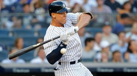 Yankees outfielder Aaron Judge is hit by a