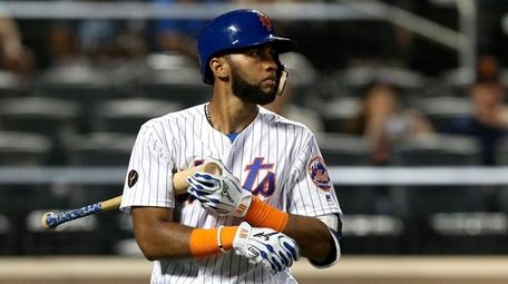 Amed Rosario of the Mets walks back to