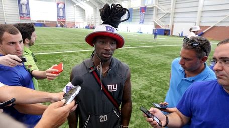 Giants corner back Janoris Jenkins talks to the