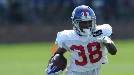 Giants cornerback Donte Deayon (38) runs back an