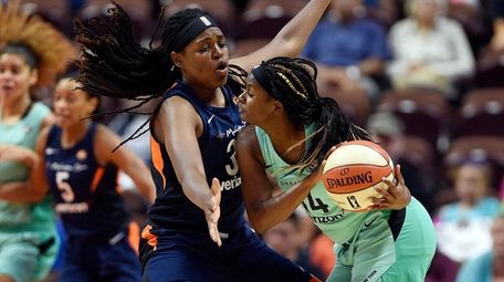 Sun center Jonquel Jones pressures Liberty guard Sugar