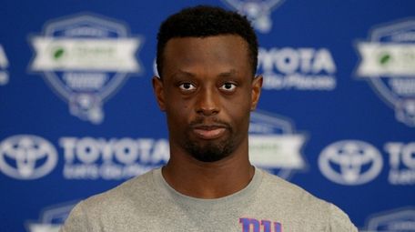 Giants cornerback Eli Apple talks to the media