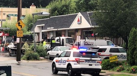 Nassau County police investigate the scene of a