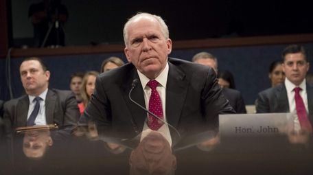 Former CIA Director John Brennan testifiies before the