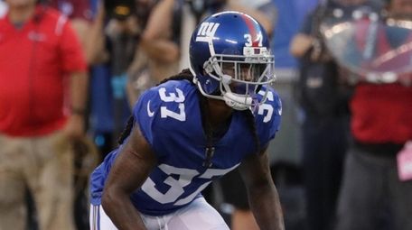 Giants defensive back B.W. Webb lines up against
