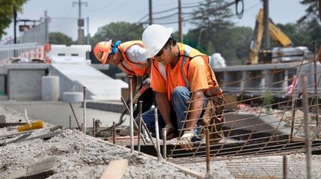 Crews work last week to complete the LIRR's
