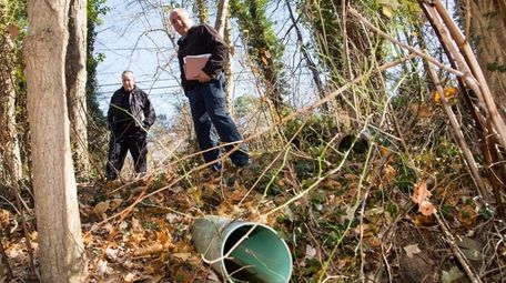 Chris Grella, right, a code enforcement liason working