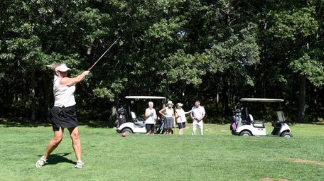 Hope LaBorne tees off on the golf course