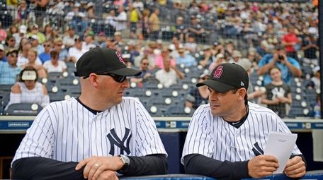 Josh Bard, usually the Yankees' bench coach, filled
