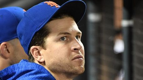 Mets pitcher Jacob deGrom looks on from the
