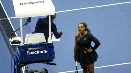 Serena Williams argues with the chair umpire during