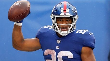 Saquon Barkley of the Giants reacts after his