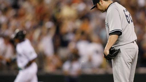 New York Yankees pitcher Joba Chamberlain reacts on