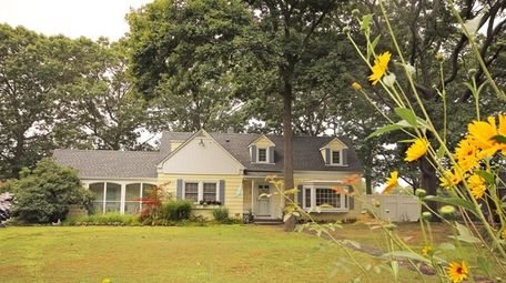 This 1940s-era Bay Shore home has four-bedrooms, a