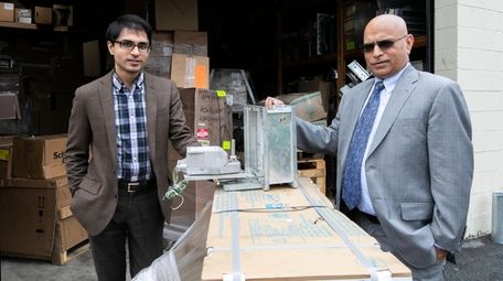Fahd Reyaz, left, legal counsel of ACS System