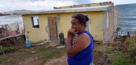 Maria Martinez and her hurricane-damaged house in eastern