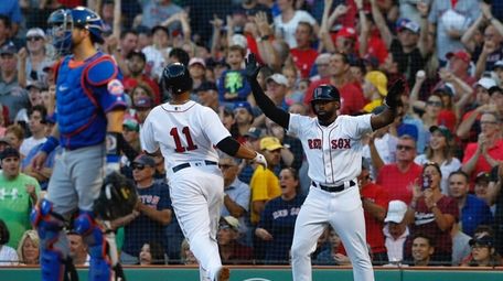 Boston Red Sox' Jackie Bradley Jr (R) celebrates