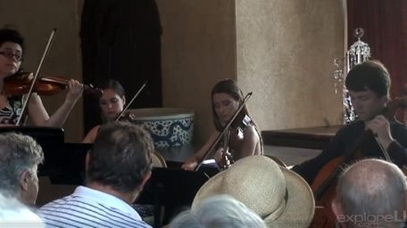 Chamber players perform Vivaldi at Planting Fields Arboretum.