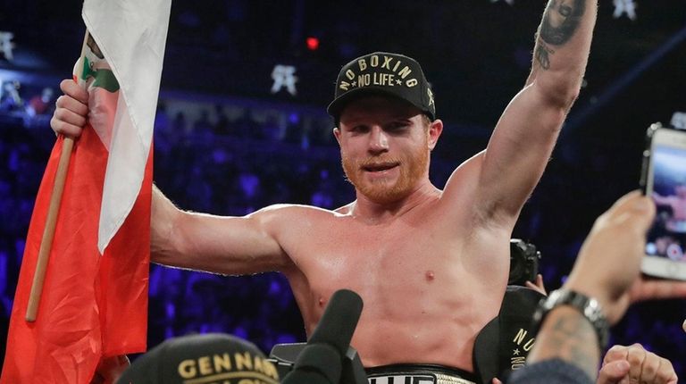 Canelo Alvarez celebrates after defeating Gennady Golovkin by