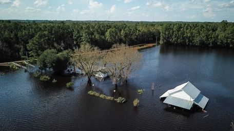A North Carolina farm is flooded next to