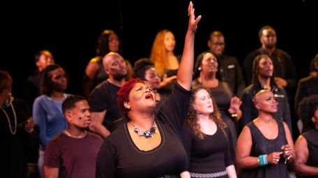 De-Rance Blaylock, center, and choir members in Theater